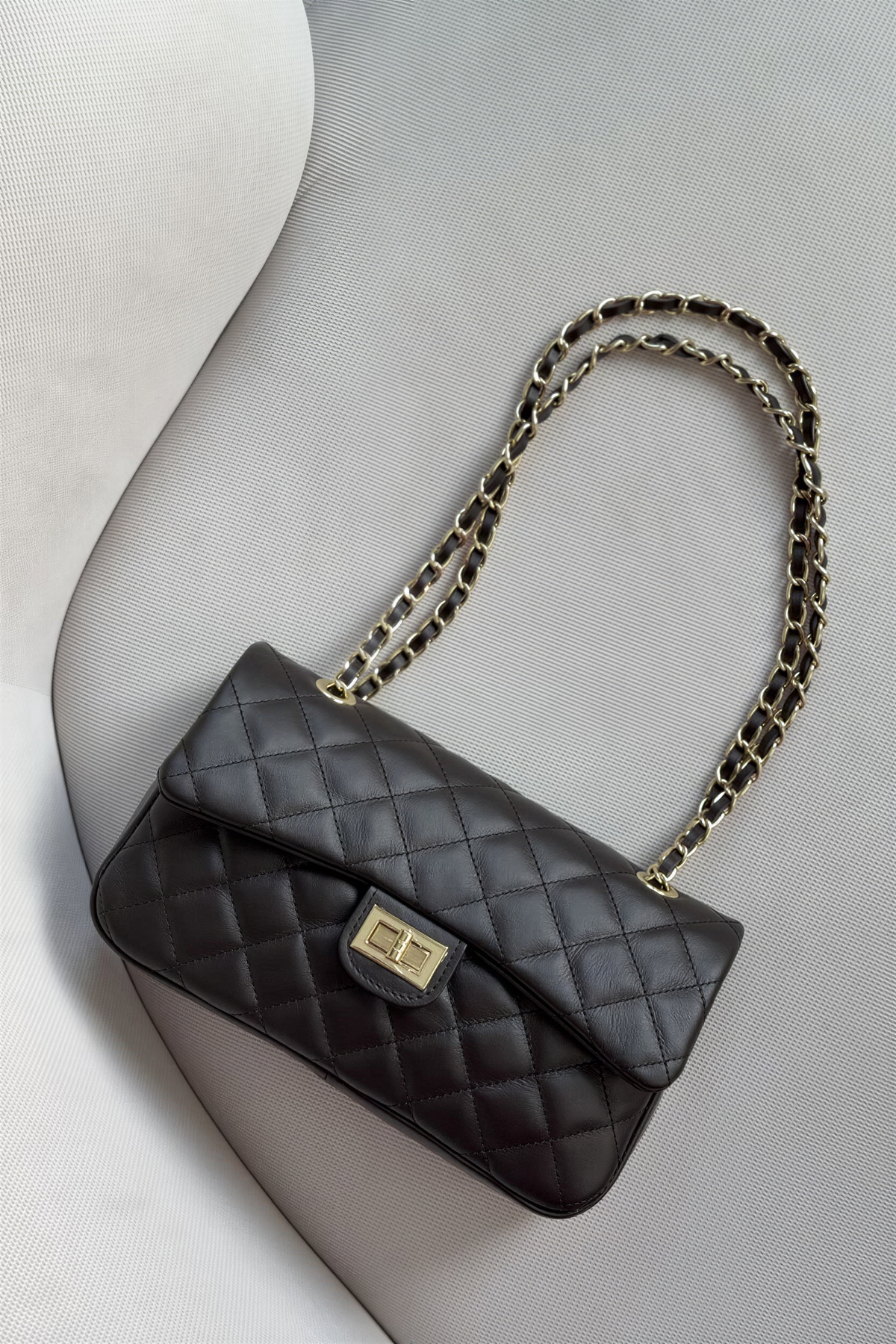 Genuine leather quilted shoulder bag with chain